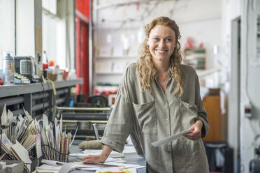 Portrait of female print designer in workshop - CUF29567