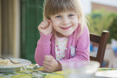 Portrait of girl having breakfast at table - CUF30115