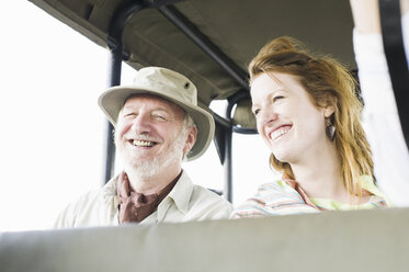 Portrait of senior man and daughter on safari in four wheel drive, Kafue National Park, Zambia - CUF30126