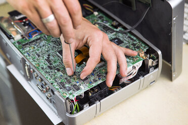 Man repairing circuit board, close up - ISF09607