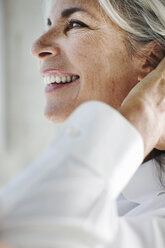 Close up of beautiful mature woman with hand in hair - ISF09618