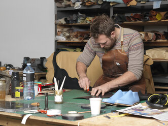 Shoemaker working in workshop - CUF30569