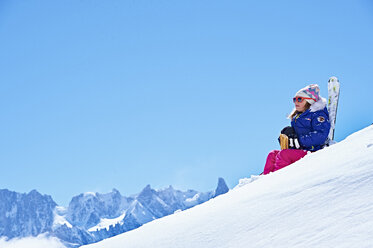 Girl resting on snow, Chamonix, France - CUF31239