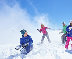 Family having snowball fight, Chamonix, France - CUF31266