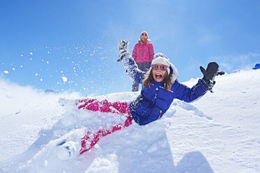 Girl falling into snow, Chamonix, France - CUF31272