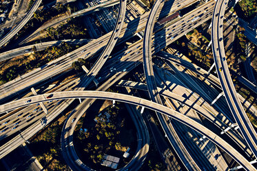 Aerial view of sunlit curved flyovers and highways, Los Angeles, California, USA - ISF09704