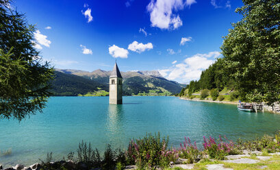 Church spire in turquoise lake, Trentino Alto Adige, Italy - CUF31358