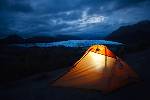 USA, Alaska, illuniated tent at Matanuska Glacier stock photo