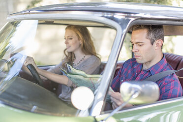 Heterosexual couple in car together, looking lost - ISF09766