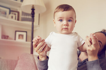 Mother and baby boy playing in living room - CUF31907