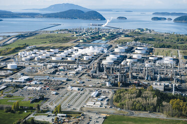 High angle view of coastal oil refinery with white oil storage tanks - ISF09853