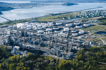 High angle view of coastal oil refinery with oil storage tanks - ISF09854
