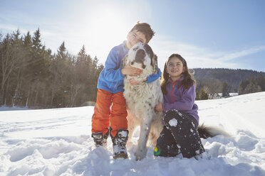 Brother and sister with their pet dog - ISF09899