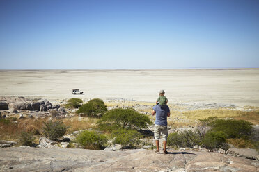 Father and son enjoying view, Kubu Island, Makgadikgadi Pan, Botswana, Africa - ISF09948