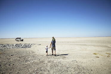 Father and sons enjoying view, Kubu Island, Makgadikgadi Pan, Botswana, Africa - ISF09949