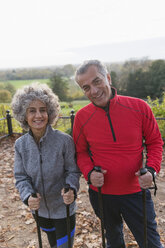 Portrait smiling, confident active senior hikers with poles - CAIF20926