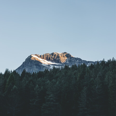 Italy, Lombardy, Chiesa in Valmalenco, mountaintop in the morning light stock photo