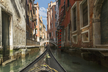 Close up of part gondola with canal bridge in distance, Venice, Veneto, Italy - CUF32773