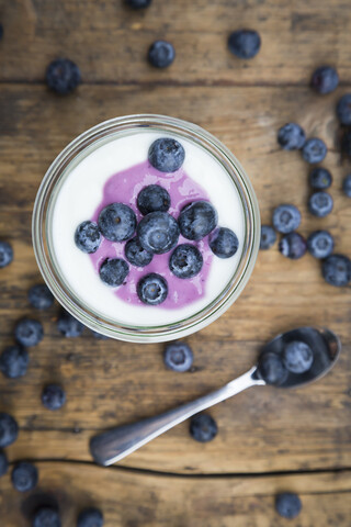 Blueberry yogurt curd dessert on wood stock photo