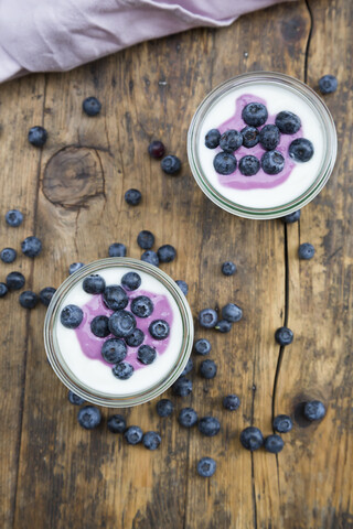 Blueberry yogurt curd dessert on wood stock photo