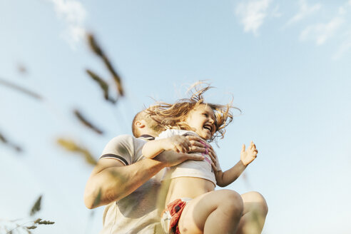 Father playing with his little daughter in nature - KMKF00366