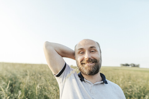 Portrait of mature man pulling funny faces in nature stock photo