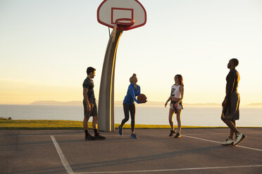 Group of friends playing basketball, outdoors - ISF10722