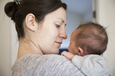 Mother holding baby daughter - ISF10754