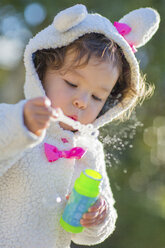Little girl blowing bubbles - ISF10806
