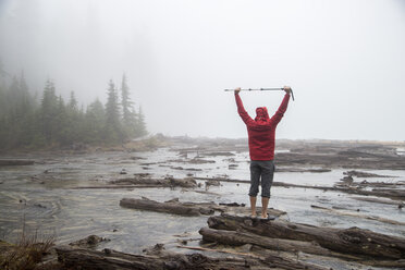 Hiker by lake, Lake Blanco, Washington, USA - ISF11640