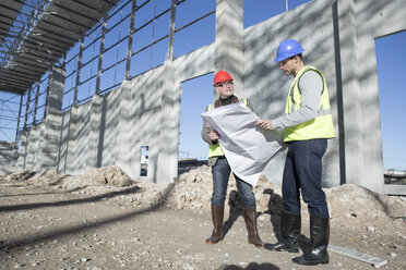 Surveyor and architect meeting on construction site - ISF11891