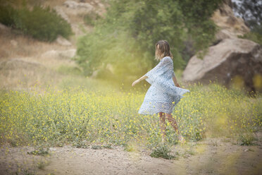 Woman dancing in park, Stoney Point, Topanga Canyon, Chatsworth, Los Angeles, California, USA - ISF12427
