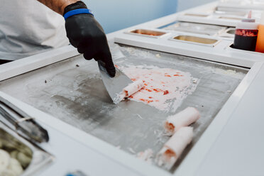 Preparing roll of ice in an ice cream shop - OCAF00302