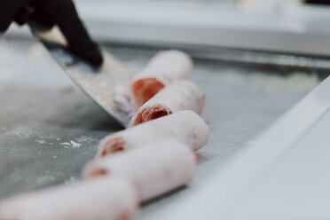 Preparing roll of ice in an ice cream shop - OCAF00303