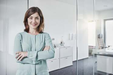 Portrait of smiling businesswoman in office - RORF01357