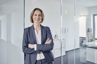 Portrait of smiling businesswoman in office - RORF01358