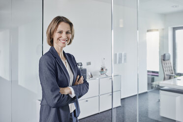 Portrait of smiling businesswoman in office - RORF01359