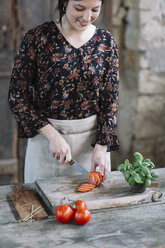 Woman preparing Caprese Salad - ALBF00517