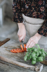 Woman preparing Caprese Salad, partial view - ALBF00518