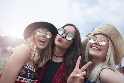 Portrait of three women having fun at the music festival - ABIF00604