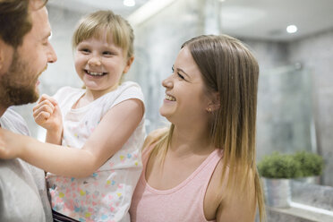 Mother, father and daughter having fun in bathroom - AWF00082