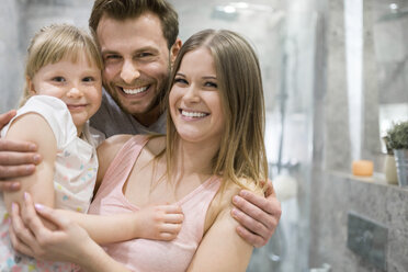 Mother, father and daughter having fun in bathroom - AWF00083