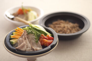 Asian food in steamer lid - ISF12810