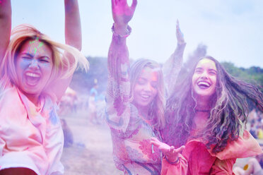 Crazy friends having fun with holi powder - ABIF00628