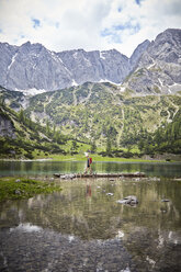 Young boy exploring lake, Ehrwald, Tyrol, Austria - ISF13670