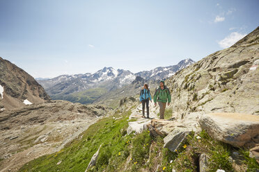 Young couple hiking at Val Senales Glacier, Val Senales, South Tyrol, Italy - ISF13685