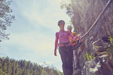 Couple rock climbing, Ehrwald, Tyrol, Austria - ISF13734