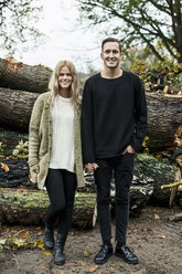 Portrait of young happy couple in woods - CUF33165