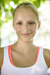Close up portrait of female basketball player in park - CUF33356