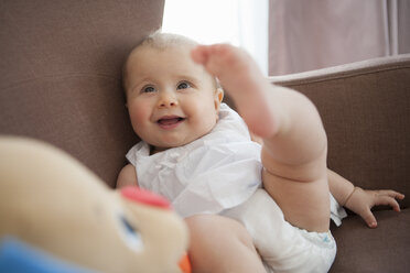 Baby playing in armchair - CUF33536